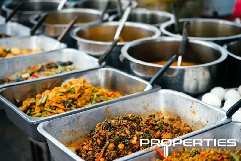 Thai food stall at a street market on Koh Samui, part of everyday living costs for residents